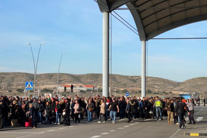 Passengers are evacuated from Alicante-Elche Airport in 2020 after a fire erupted in the terminal