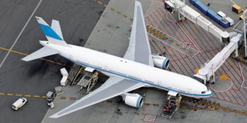 A Boeing 777 is being serviced at a MARS gate